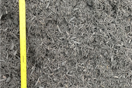 loose black mulch by the bucket