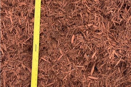 loose red mulch by the bucket